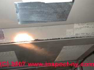 Photograph of debris at a furnace draft hood