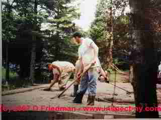 Photograph of workers installing a concrete floor slab  &copy; Daniel Friedman 2007
