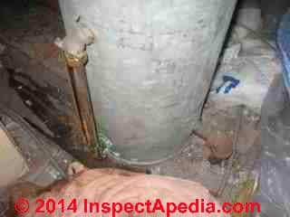 Attic expansion tank inspection for leaks (C) InspectApedia.com Hein