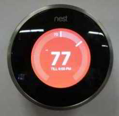 Nest learning thermostat showing programming mode - InspectApedia.com at Home Depot display
