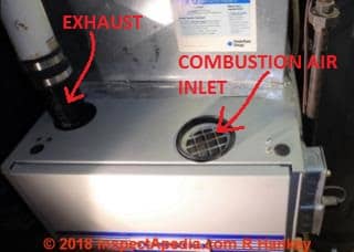 Top of Tempstar condensing gas furnace shows signs of reverse air flow (C) Roger Hankey at InspectApedia.com