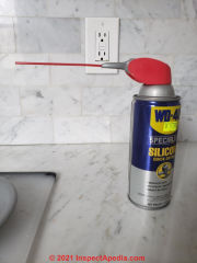 Spray silicone by WD40 can diagnose heating pipe noises (C) InspectApedia.com David