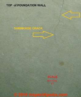 Short shrinkage crack at top of foundation wall (C) InspectApedia.com