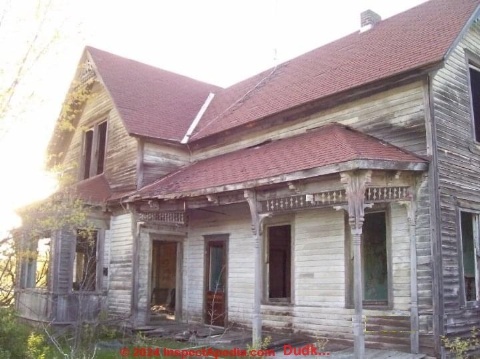 Wood frame home built ca 1900, possibly involving Sears Kit House parts, beyond economic repair (C) Inspectapedia.com Dudk...