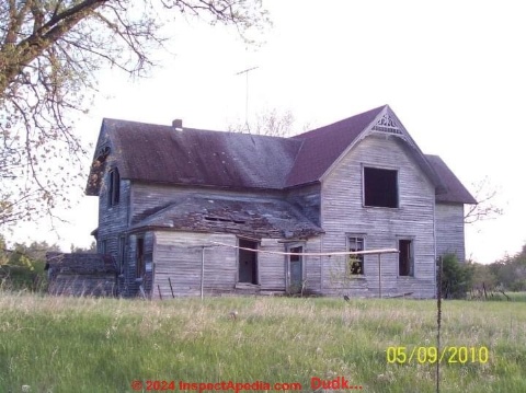 Wood frame home built ca 1900, possibly involving Sears Kit House parts, beyond economic repair (C) Inspectapedia.com Dudk...