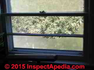 Window condensation due to leaky storm window (C) Daniel Friedman