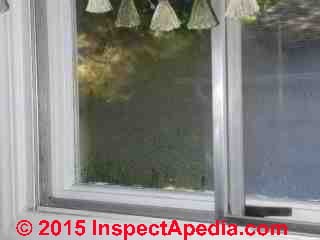 Window condensation in a kitchen with an interior storm (C) Daniel Friedman
