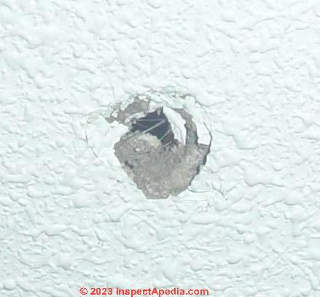 small hole in drywall (C) InspectApedia.com JesusV