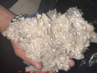 Mineral wool insulation mixed with chopped newsprint (C) Inspectapedia.com Sam