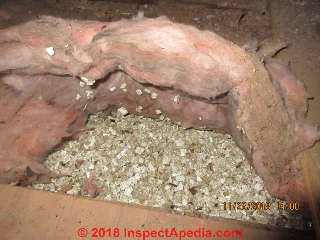Attic loose fill vermiculite found under fiberglass: test for possible asbestos contamination (C) Inspectapedia.com David Grudzinski