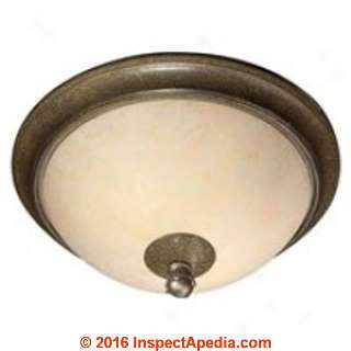 Vermiculite insulation in a ceiling-mounted light fixture (C) InspectApedia.com SE