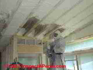 Spray foam insulation installed under a low slope metal roof (C) Daniel Friedman at InspectApedia.com