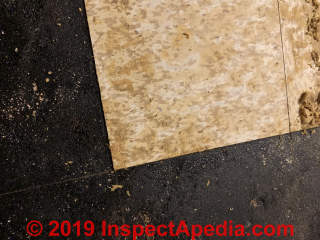Cork pattern vinyl asbestos-suspect floor tile partly removed (C) InspectApedia.com reader KS