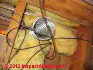 Bath vent spills into attic © D Friedman at InspectApedia.com 