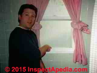 Photograph of - damaged vinyl siding