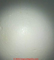 Brown water drips on wall (C) InspectApedia.com LLI
