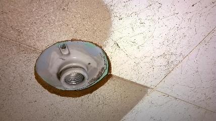 Water leak damaged ceiling tile, possible asbestos (C) InspectApedia.com unlucky