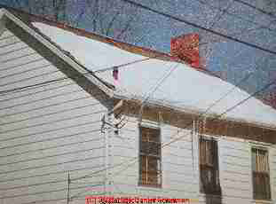 Photograph of house B with no under-roof venting, otherwise identical design to A and next-door to it