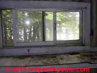 Green cabin windows before renovations (C) Daniel Friedman