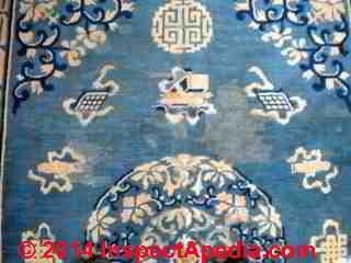 What caused the light coloure "Stains" on this rug ? Diagnosis suggestions (C) InspectAPedia BB