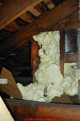Photo of UFFI foam insulation in a building attic