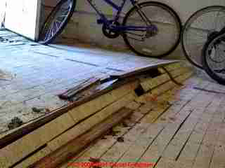 Badly buckled wood flooring due to water damage