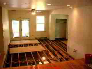 Photograph of an extensive mold remediation project after demolition and cleaning of subflooring and floor joists