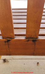 Black stains on porch swing wood (C) InspectApedia.com Rashid