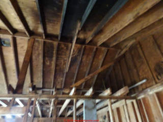 Fire sealant not visible on charred attic rafters & roof sheathing (C) InspectApedia.con Ranwin