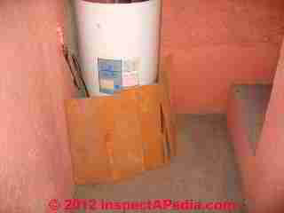 Hair clogged gas water heater vent hood (C) Daniel Friedman