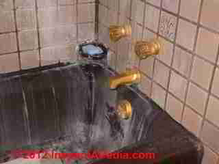 Bathtub stains hard water © D Friedman at InspectApedia.com 