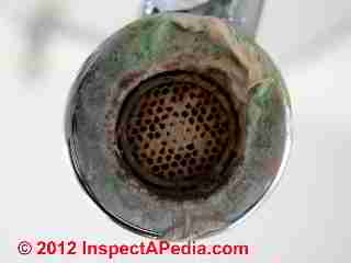 Deposits and stains on faucet strainer (C) D Friedman