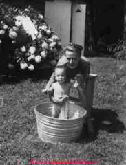 Author having a bath in a galvanized tub in Dunnsville Va ca 1945 (C) Daniel Friedman at InspectApedia.com