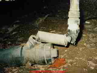 Photograph of sewer line break in a crawl space