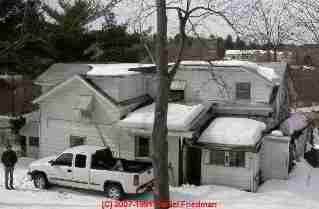 Photograph of a house with missing plumbing vents