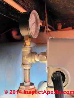 Water pressure gauge on pipe tee (C) Daniel Friedman