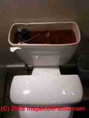 Toilet with tank lid on seat