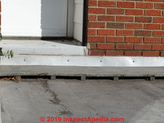Synthetic decking walkway on a flat modified bitumen roof (C) Daniel Friedman at InspectApedia.com