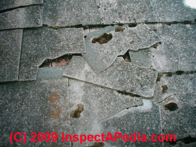 Damaged asbestos cement roofing (C) Daniel Friedman