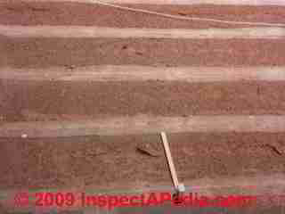 Photograph of  really worn out asphalt roof shingles