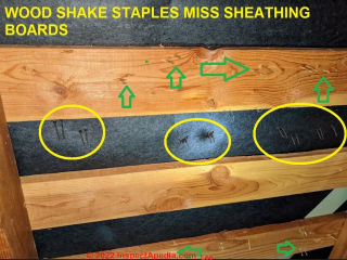 Too many staples may damage wood shakes or shingles and these also miss the skip sheathing boards (C) InspectPedia.com