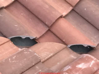 Poorly fit clay roof tiles at valley (C) InspectApedia.com Michael