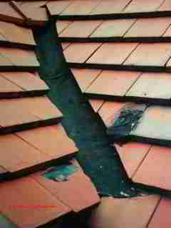 Open clay tile roof valley © D Friedman at InspectApedia.com 