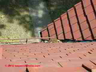 Open clay tile roof valley © D Friedman at InspectApedia.com 