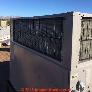 Hail damaged rooftop AC compressor/condenser air handler (C) InspectApedia.com Russell Frazier
