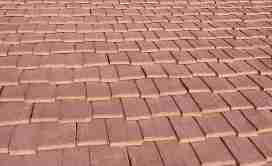 Photograph of  really worn out asphalt roof shingles