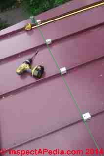 S!5 Snow Guard clamp installation on a standing seam metal roof (C) Daniel Friedman