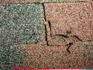 Photograph of foot traffic damage on asphalt roof shingles