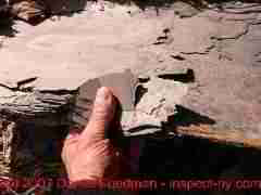 Photograph of worn out rotted roofing slates