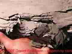 Photograph of worn out rotted roofing slates